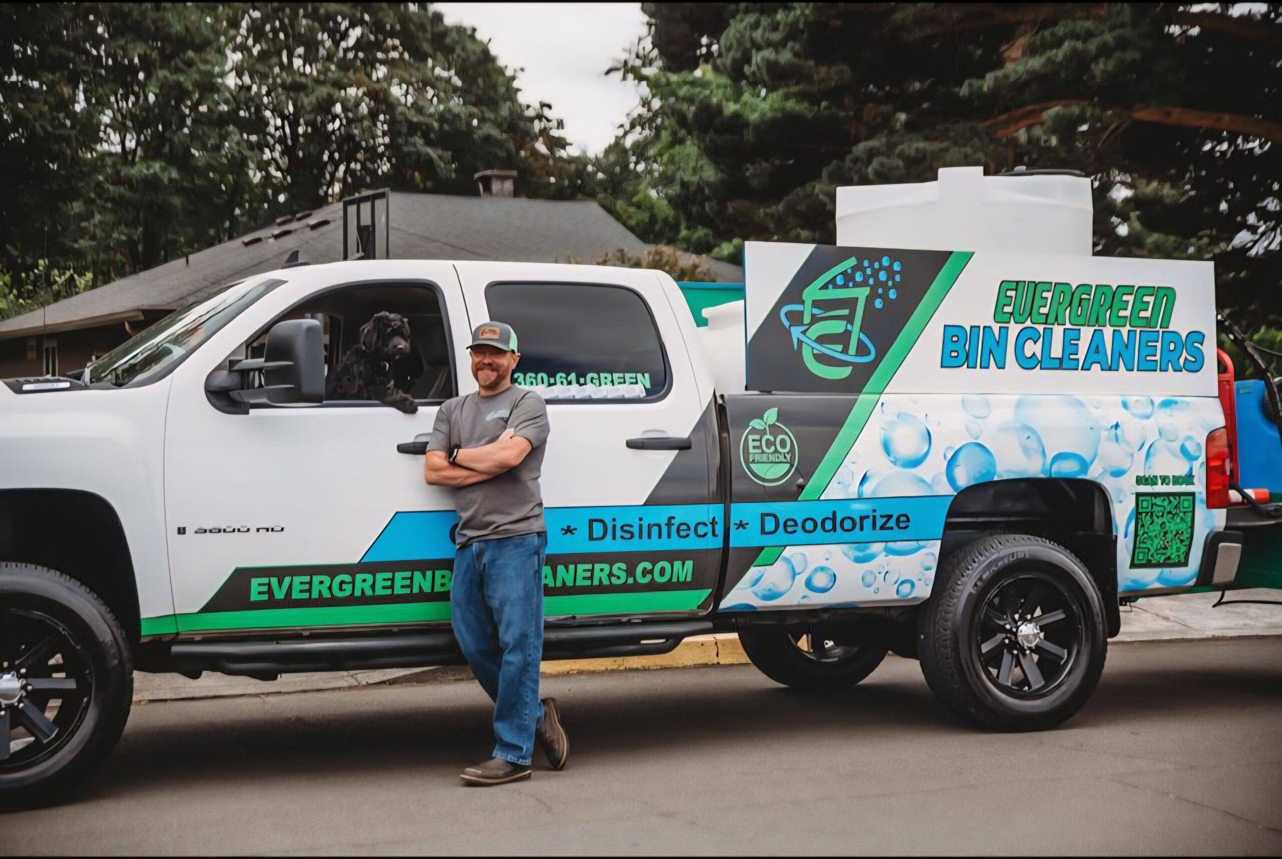 Evergreen Bin Cleaners owner Ken Hill with branded bin-cleaning truck in Camas, Washington